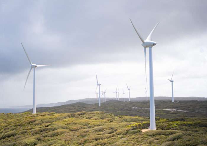 Photo of wind turbines under cloudy sky
