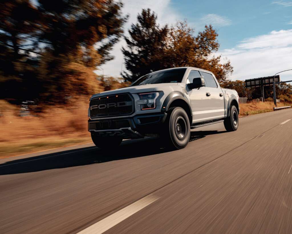A ford f 150 raptor on the road